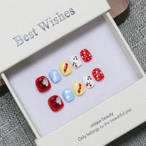 Handmade press-on nails for kids with 3D cherry and cloud designs in a gift box