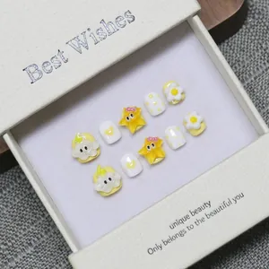 Cute cartoon 3D handmade press-on nails set with yellow stars and floral relief in gift box