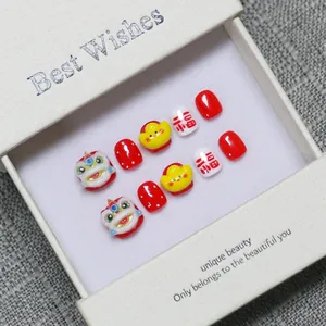 Faux ongles faits main pour le Nouvel An chinois avec motifs de lion et de lingot d'or