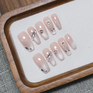 Handmade coffin press-on nails with pink cat-eye gradient, silver butterflies and crystals
