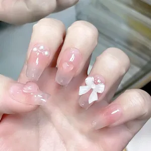 Pink blush gradient press-on nails with 3D bows, hearts and pearls decoration