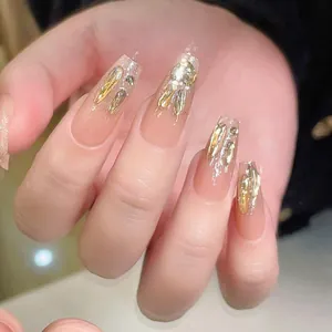 Elegant champagne rabbit press-on nails with pink gradient and gold leaf details