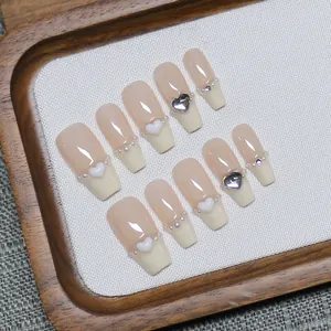 Handmade press-on nails with 3D white hearts and pearls in french pink and beige