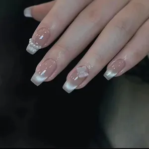 Pink cat eye press-on nails with silver glitter, 3D butterfly, and pearl accents