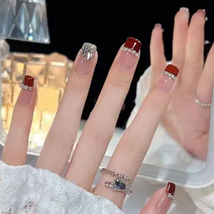 Handmade cherry red French press-on nails with silver glitter and diamond accents