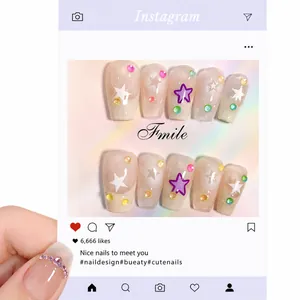 Handmade short gradient press-on nails with star patterns and colorful rhinestones
