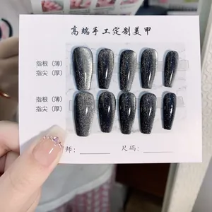 Handmade cat-eye press-on nails set with grey gradient and silver glitter shimmer effect