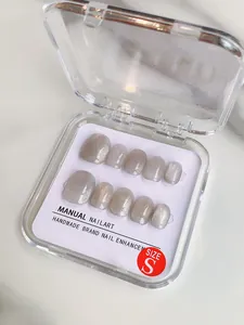 Detailed view of silver grey cat eye handmade press-on nails in size S packaging