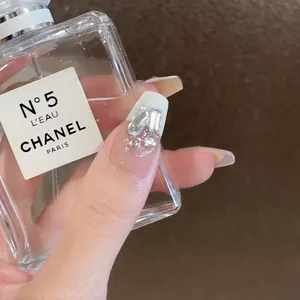 Handmade pearl white coffin fake nails with silver glitter and sparkling crystals