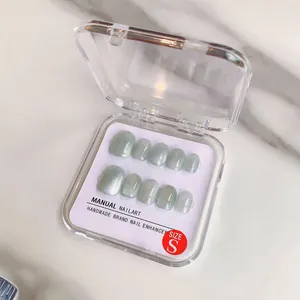 Handmade light green cat eye press-on nails set in Size S with glossy glitter finish
