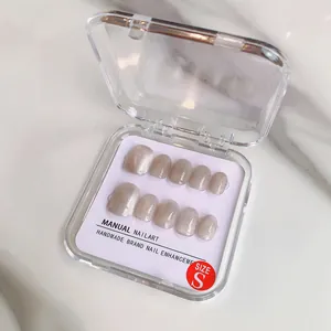 Handmade silver grey cat-eye press-on nails in size small with a square oval shape