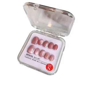 Handmade pink purple cat eye press-on nails with silver glitter in storage box