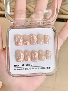 Close-up of handmade press-on nails with mermaid aurora texture and pearl accents