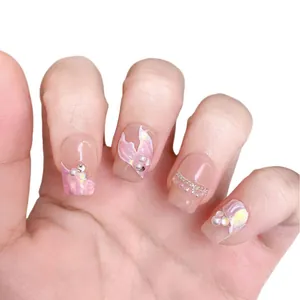 Handmade press-on nails with mermaid aurora pink finish, pearls and gold chain details