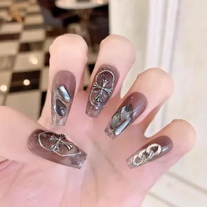 Dark brown translucent press-on nails with silver gothic crosses and chains