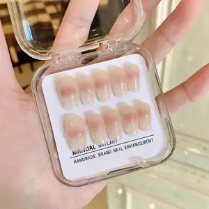 Handmade gradient pink press-on nails in long coffin shape with storage box