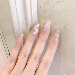 Handmade press-on nails with long coffin shape, 3D floral accents and pearls
