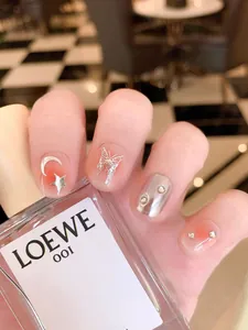 Handmade press-on nails with silver butterfly, rhinestones, and red gradient design