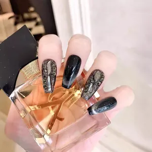 Black cat eye press-on nails with luxury rhinestones and silver 3D metal charms