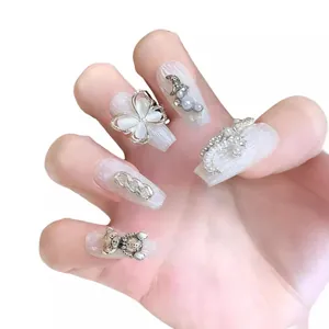 Handmade press-on nails featuring cat-eye butterfly and pearl moon in baroque style