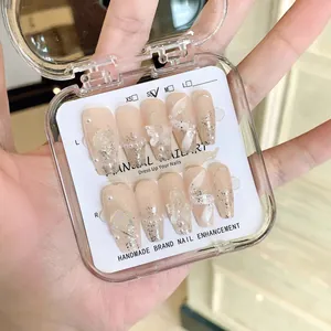 Handmade soft pink press-on nails with 3D pearls, butterflies and roses in clear case