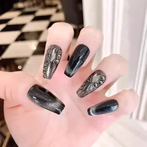 Long coffin black cat-eye press-on nails with luxury grey crystals and metallic accents