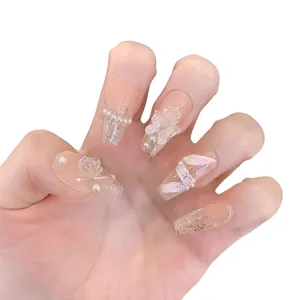 Handmade sheer press-on nails with 3D white roses, bows, and sparkling silver glitter