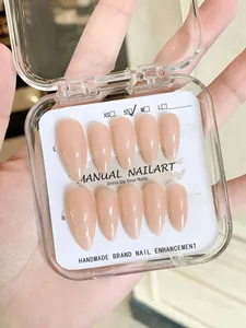 Detail of handmade nude pink almond press-on nails in a professional S-size package