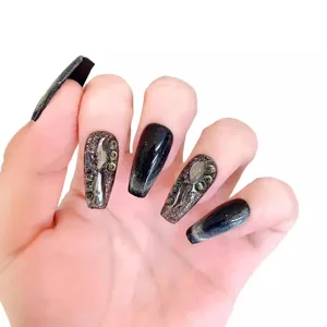 Black cat-eye coffin press-on nails with 3D crystal gems and shimmering magnetic finish