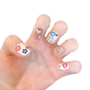 Handmade Y2K press-on nails with 3D hearts and colorful glitter star designs