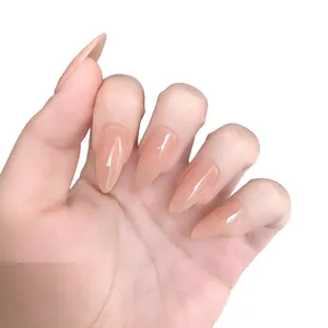 Glossy nude pink almond-shaped press-on nails shown on hand against a white background