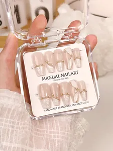 Detailed close-up of pink marble press-on nails featuring delicate gold lines and pearls
