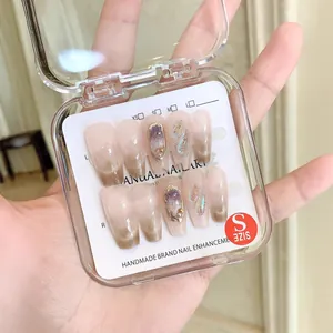 Handmade cat eye press-on nails with luxury aurora diamonds and French gradient finish
