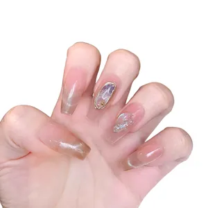 Handmade long ballerina press-on nails with pink cat eye gems and glitter aurora finish