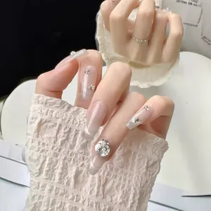Elegant long coffin press-on nails with sparkling cat-eye glitter and luxury crystals