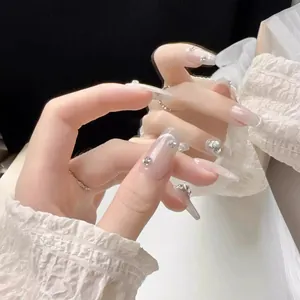 Handmade cat eye press-on nails with luxury rhinestones and pink gradient glitter