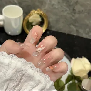 Detailed view of handmade Rococo press-on nails with 3D rabbits and bow decorations