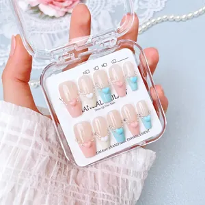 Handmade press-on nails with 3D colorful hearts and pearls in a French style