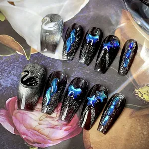 Handmade press-on nails featuring black and silver glitter with 3D swan and butterfly charms
