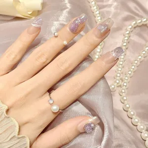 Handmade press-on nails with purple cat-eye glitter, butterfly 3D charms and pearls