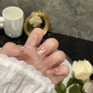 Handmade Rococo press-on nails with 3D bunny, bows, and sequins on pink gradient base