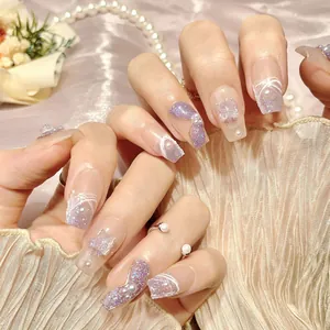 Handmade purple cat-eye press-on nails with 3D butterfly and pearl accents