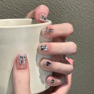 Faux ongles faits main avec cristaux brillants et papillons 3D en métal argenté