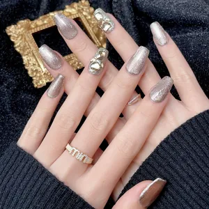 Luxurious long coffin champagne gold glitter press-on nails with teardrop crystals