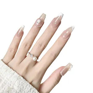 Handmade coffin nails with camellia flowers, pearls and French tip design in nude pink