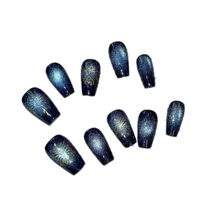 Handmade blue cat-eye press-on nails with golden firework patterns and glitter finish