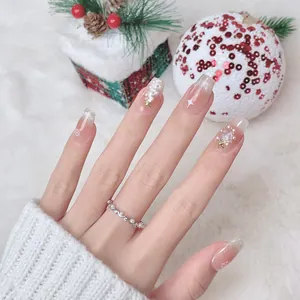 Handmade Christmas press-on nails with French gradient, pearls, and snowflake designs