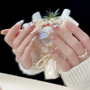 Handmade coffin press-on nails with champagne gold glitter and luxury crystal rhinestones