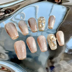 Mocha brown cat eye press-on nails with sparkling rhinestones in coffin shape