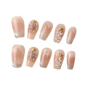 Handmade Christmas press-on nails with snowflakes, pearls and 3D tree design on pink base
